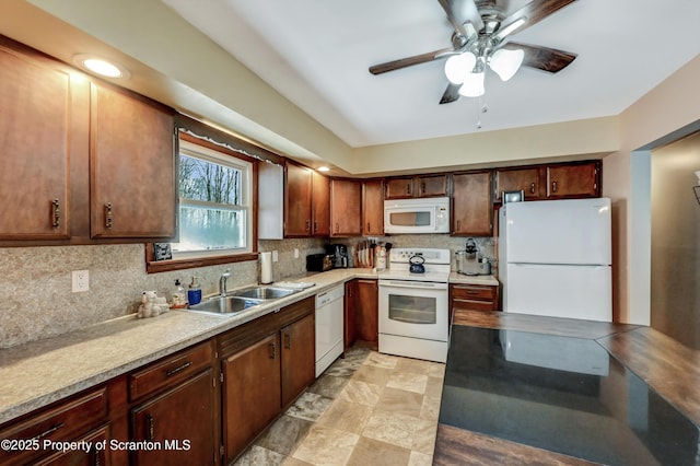 kitchen with tasteful backsplash, sink, white appliances, and ceiling fan