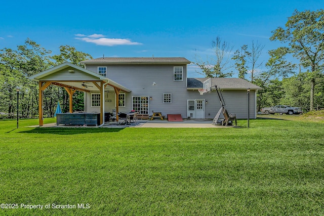 1612 Whitetail Run, Moscow, PA 18444 - rear view of house featuring a patio, a yard, and a ceiling fan