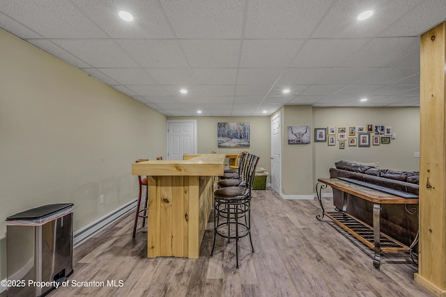 1612 Whitetail Run, Moscow, PA 18444 - indoor dry bar featuring wood finished floors, a baseboard radiator, recessed lighting, and a paneled ceiling