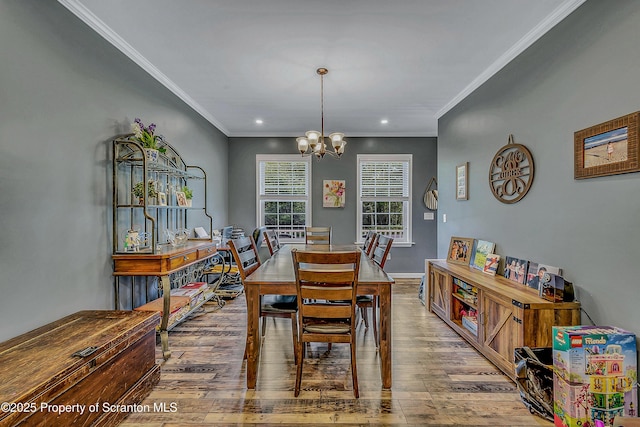 1612 Whitetail Run, Moscow, PA 18444 - dining space featuring wood finished floors, a chandelier, ornamental molding, and recessed lighting