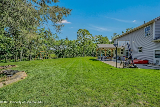 1612 Whitetail Run, Moscow, PA 18444 - view of grassy yard with a patio area and a playground