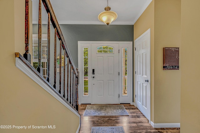 1612 Whitetail Run, Moscow, PA 18444 - entryway with wood finished floors, ornamental molding, and stairway