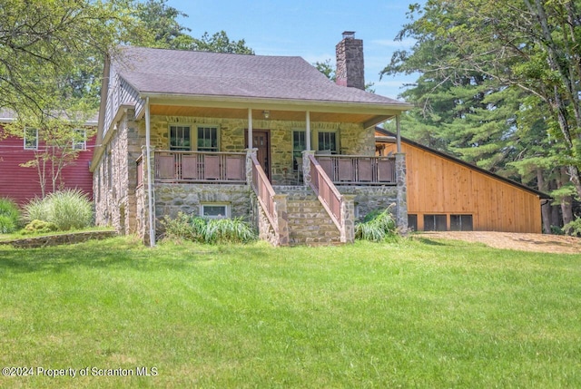 view of front of property with a porch and a front yard