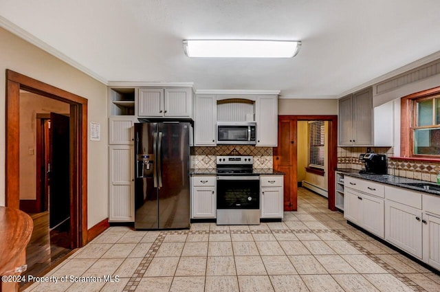 kitchen featuring light tile patterned floors, stainless steel appliances, a baseboard radiator, and ornamental molding