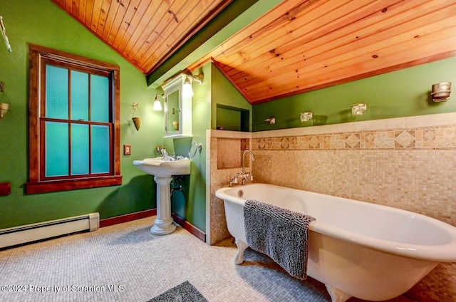 bathroom with wooden ceiling, a tub to relax in, baseboard heating, and vaulted ceiling