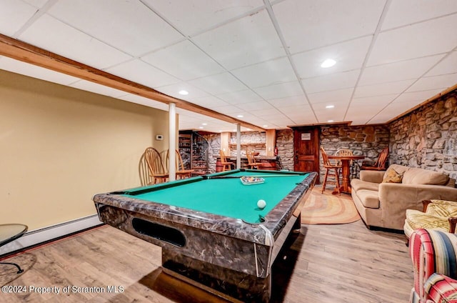 recreation room featuring light wood-type flooring, a baseboard radiator, a drop ceiling, and billiards