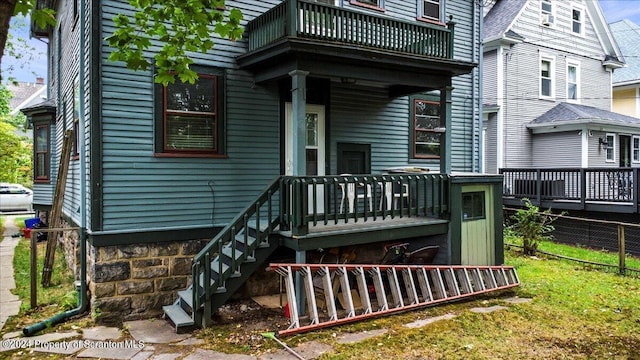 rear view of house with a balcony