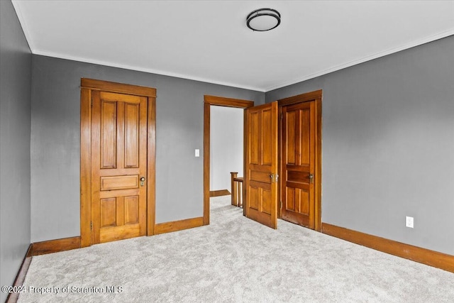 unfurnished bedroom featuring light colored carpet