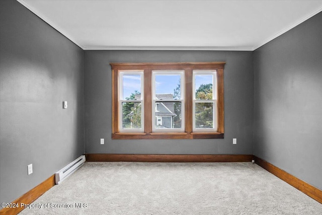 spare room featuring carpet, crown molding, and baseboard heating