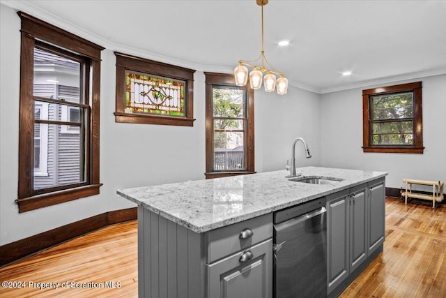 kitchen featuring ornamental molding, gray cabinetry, sink, a center island with sink, and dishwasher