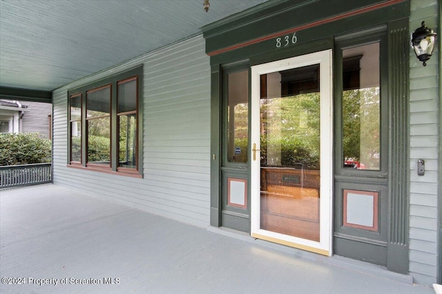 entrance to property with a porch