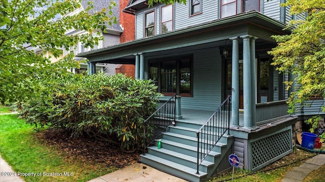 doorway to property featuring a porch