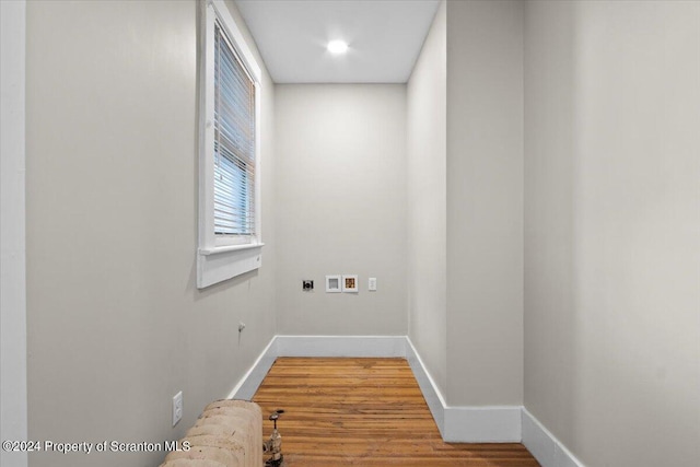 washroom featuring hookup for an electric dryer, washer hookup, and hardwood / wood-style flooring