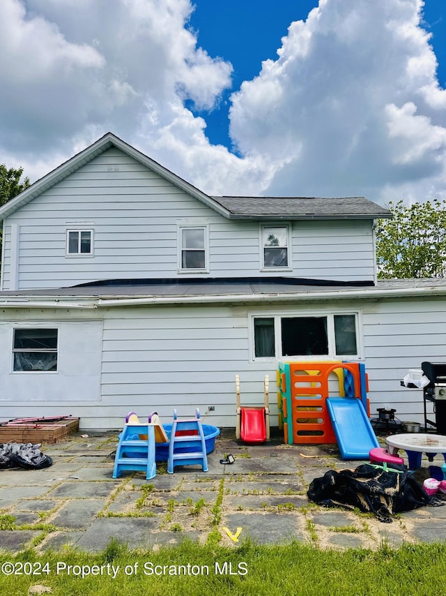 rear view of house with a patio