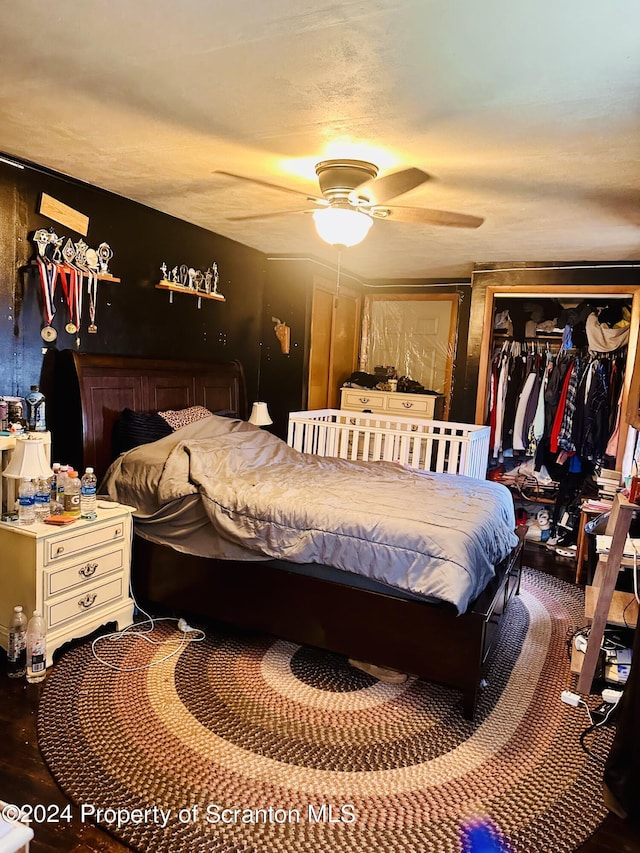 bedroom with ceiling fan and a closet