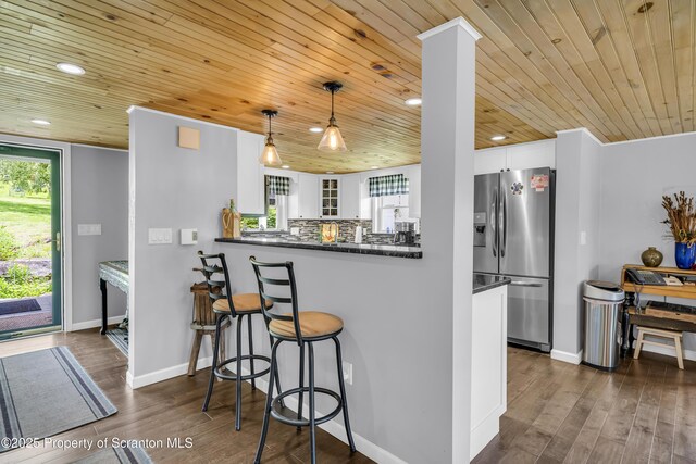 1715 Booth Rd, Hallstead, PA 18822 - kitchen with stainless steel fridge with ice dispenser, wood ceiling, dark countertops, white cabinets, and dark wood-type flooring
