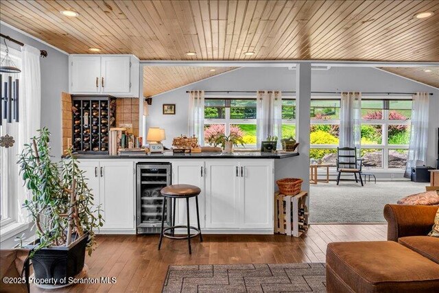 1715 Booth Rd, Hallstead, PA 18822 - indoor dry bar featuring wine cooler, wood ceiling, vaulted ceiling, dark wood finished floors, and recessed lighting