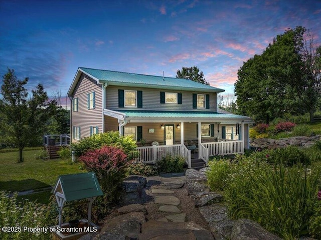 1715 Booth Rd, Hallstead, PA 18822 - view of front of house with a porch, a metal roof, and a front yard
