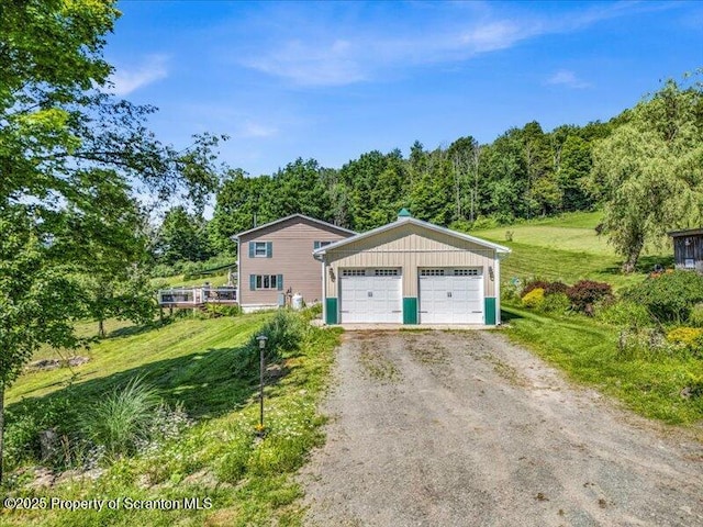 1715 Booth Rd, Hallstead, PA 18822 - view of front of property featuring a garage and a front lawn