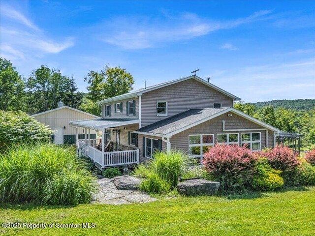 1715 Booth Rd, Hallstead, PA 18822 - rear view of property with covered porch and a lawn