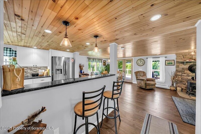 1715 Booth Rd, Hallstead, PA 18822 - kitchen featuring stainless steel refrigerator with ice dispenser, wood ceiling, white cabinetry, decorative light fixtures, and open floor plan