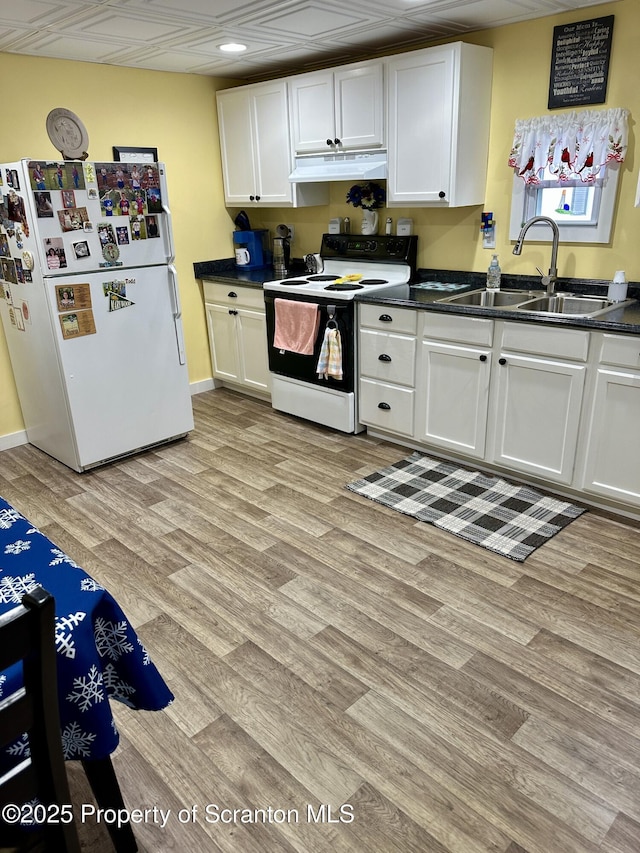 kitchen featuring white cabinetry, light wood-type flooring, white appliances, and sink