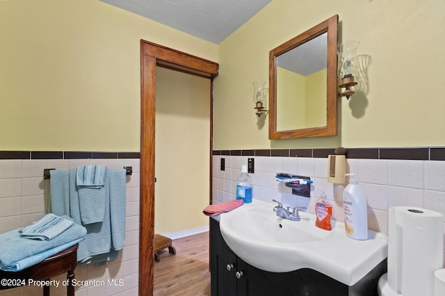 bathroom featuring wood-type flooring and vanity