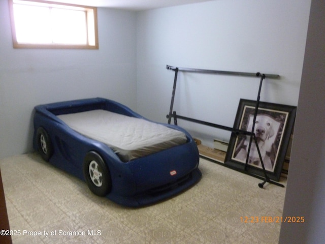 bedroom with a baseboard heating unit