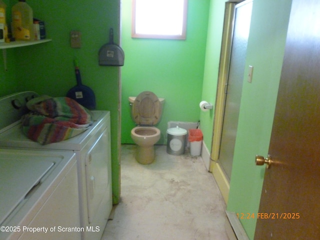 washroom featuring laundry area and washer and clothes dryer