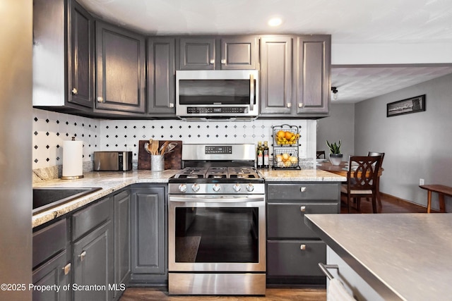 217 N Everett Ave, Scranton, PA 18504 - kitchen with tasteful backsplash, appliances with stainless steel finishes, dark wood-style flooring, a sink, and gray cabinetry