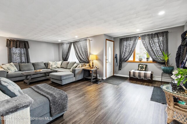 217 N Everett Ave, Scranton, PA 18504 - living area with wood finished floors, a baseboard heating unit, baseboards, and recessed lighting