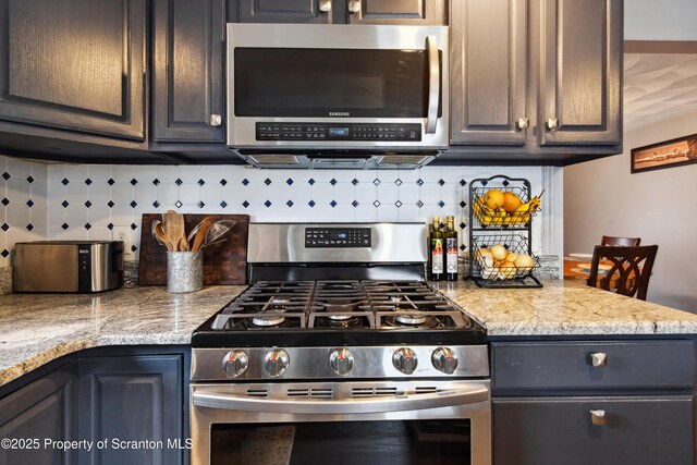 217 N Everett Ave, Scranton, PA 18504 - kitchen with light countertops, backsplash, and appliances with stainless steel finishes