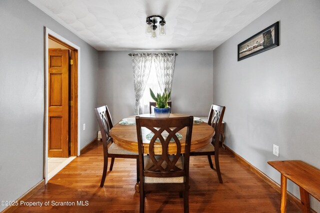 217 N Everett Ave, Scranton, PA 18504 - dining room with light wood-style floors and baseboards