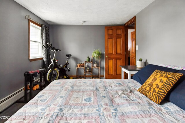 217 N Everett Ave, Scranton, PA 18504 - bedroom with baseboards, a baseboard radiator, and a textured ceiling
