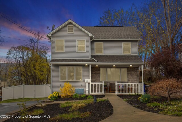 217 N Everett Ave, Scranton, PA 18504 - traditional-style house featuring roof with shingles, covered porch, and fence