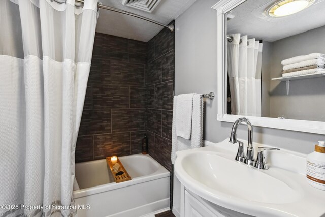 217 N Everett Ave, Scranton, PA 18504 - bathroom featuring a sink, visible vents, and shower / bath combination with curtain