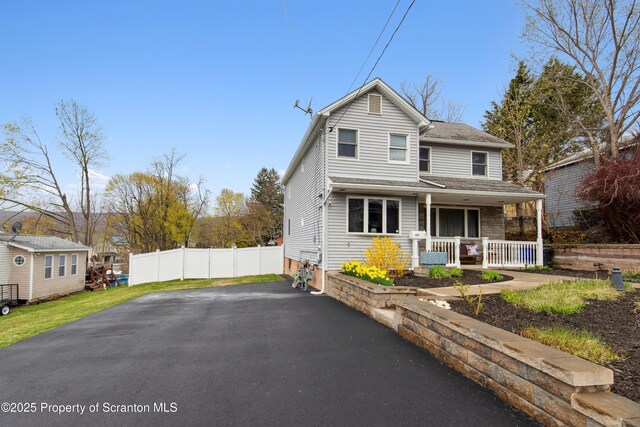 217 N Everett Ave, Scranton, PA 18504 - traditional-style home featuring a porch, a shingled roof, driveway, and fence
