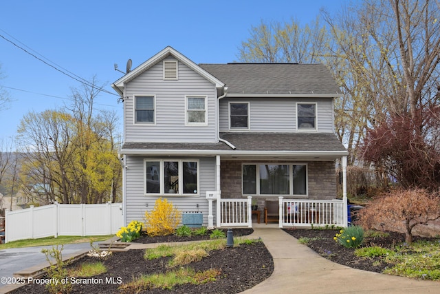 217 N Everett Ave, Scranton, PA 18504 - traditional-style home with a porch, roof with shingles, and fence