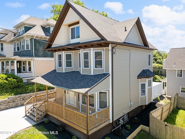 rear view of house with a porch