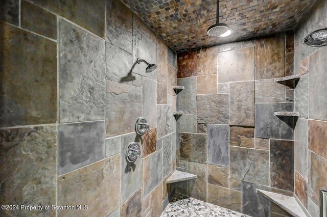 bathroom with a tile shower