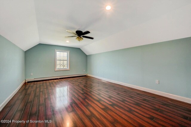 bonus room featuring dark hardwood / wood-style floors, ceiling fan, lofted ceiling, and baseboard heating