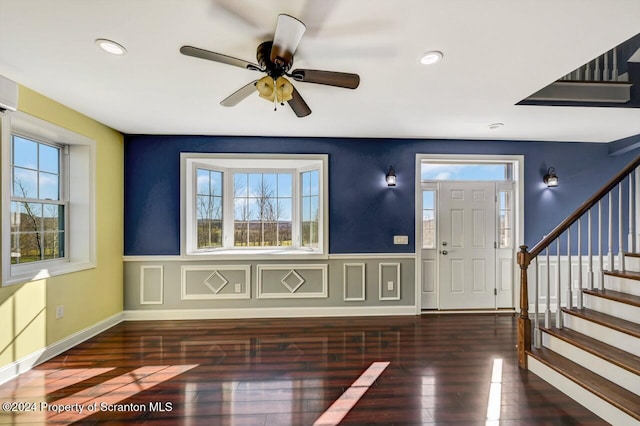 entrance foyer with ceiling fan and dark hardwood / wood-style floors