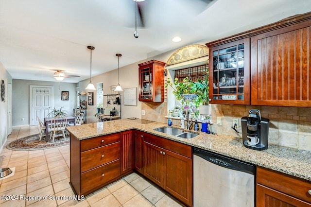 kitchen with ceiling fan, dishwasher, sink, hanging light fixtures, and kitchen peninsula