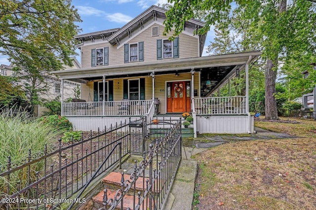 italianate home featuring a porch