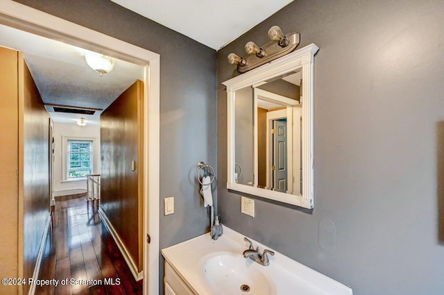 bathroom featuring vanity and hardwood / wood-style flooring