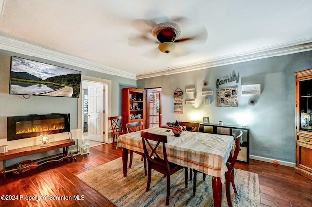 dining room featuring ceiling fan, dark hardwood / wood-style flooring, and crown molding