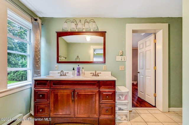 bathroom featuring tile patterned floors, plenty of natural light, and vanity