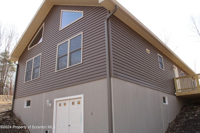 view of side of property with a deck