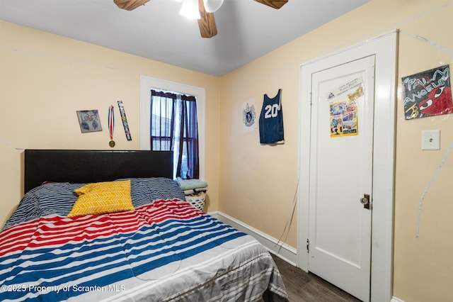 bedroom with hardwood / wood-style flooring and ceiling fan