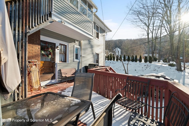 view of snow covered deck